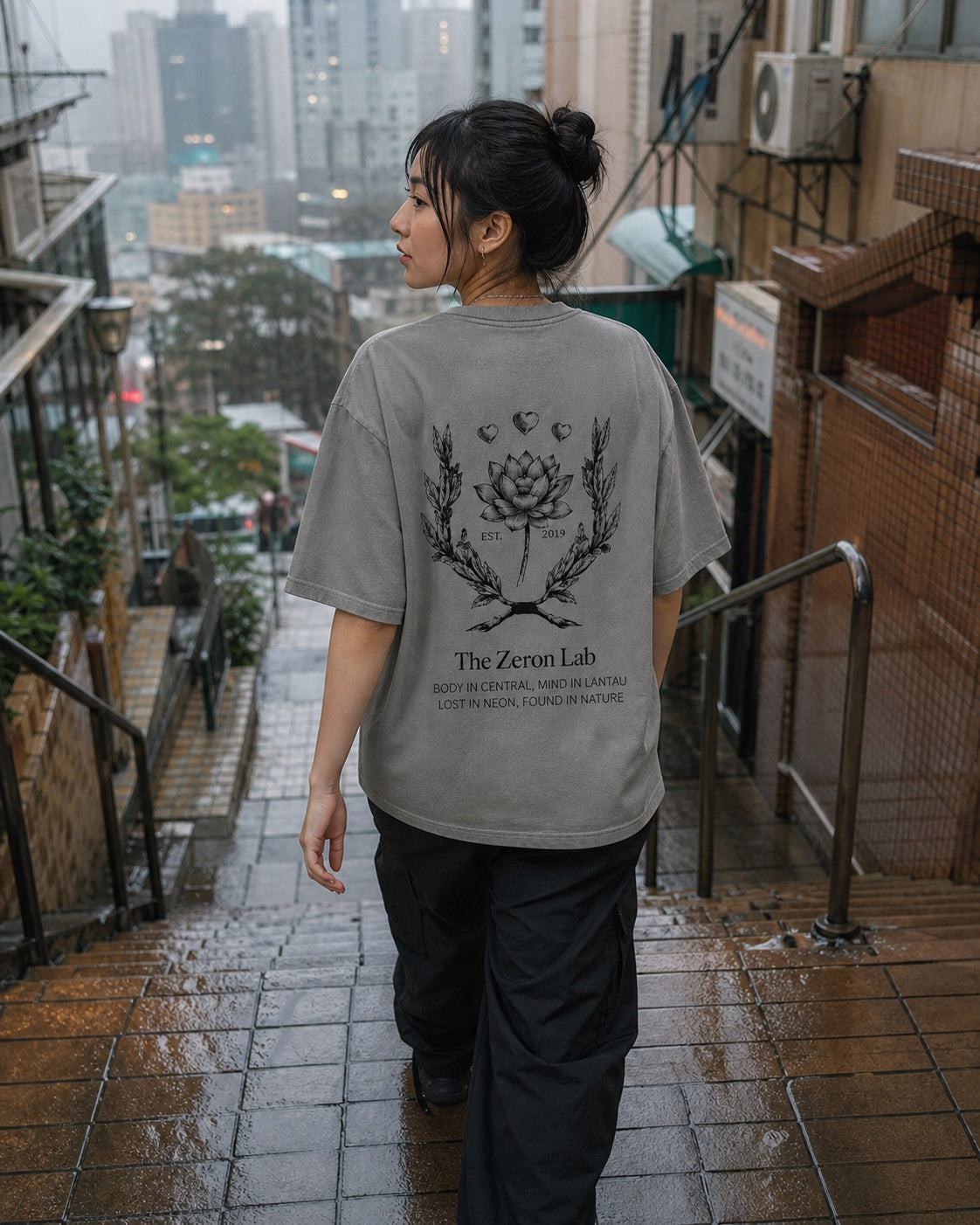 Woman wearing a Zeron T-shirt on Hong Kong neighborhood steps